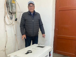 Dennis Scraba of Amigo Relief Missions with a generator his charity provided to the Dombromil State Children's Home in Dombromil, Ukraine earlier this month.