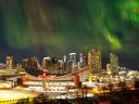 A midnight blast of northern lights over downtown Calgary, Alta., on Sunday, Feb. 26, 2023.