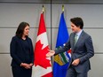 Prime Minister Justin Trudeau meets with Alberta Premier Danielle Smith as Canada's premiers meet in Ottawa on Tuesday, Feb. 7, 2023 in Ottawa. Alberta Premier Danielle Smith has met face to face with Prime Minister Justin Trudeau in a photo opportunity punctuated by short statements and a very awkward handshake.