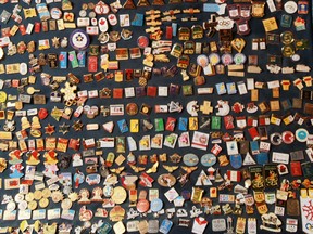 Pin trading had occurred at Olympic Games for decades, but the pursuit was reaching a frenzied pitch in Calgary in 1988. This collection of Calgary Winter Olympic pins shows just a few of the thousands of pins from the collection of Alex Biletski. Gavin Young photo/Postmedia archives.