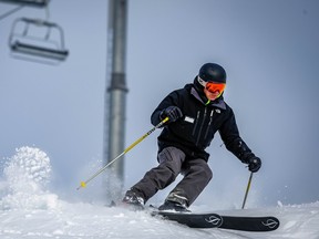Rich Burkley enjoys a few turns under the Summit chairlift after joining the team at Lake Louise ski resort as their new chief executive officer. AL CHAREST / POSTMEDIA
