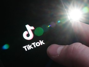 The TikTok startup page is displayed on an iPhone in Ottawa on Monday, Feb. 27, 2023. The House of Commons announced on Tuesday that it's banning the application from all House-managed devices, effective March 3, 2023.