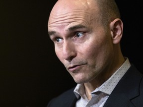 Minister of Health Jean-Yves Duclos speaks to the media at the Hamilton Convention Centre, in Hamilton, Ont., during the Liberal Cabinet retreat, Jan. 23, 2023.