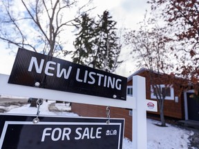 A real estate for sale sign outside a suburban home in Calgary is photographed on Tuesday, January 24, 2023.