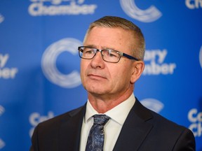 Alberta Finance Minister Travis Toews speaks to the media after an event hosted by the Calgary Chamber of Commerce on March 2, 2023.