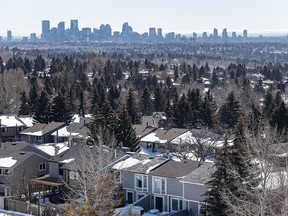 A view of the Calgary skyline with suburban homes in the foreground is photographed on Wednesday, March 22, 2023.