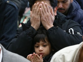 Muhammad Yusuf, age 3, joins his father Mohammed Shazeb at the Genesis Centre in northeast Calgary during the Friday prayers on the first Friday of Ramadan on Friday, March 24, 2023.