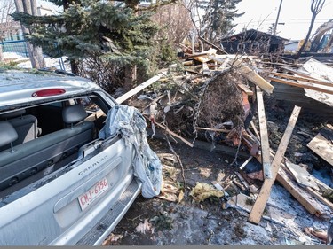 A car with shattered windows sits the aftermath of the explosion that took place in northeast Calgary on Tuesday morning.
