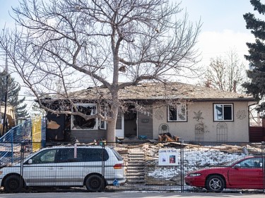 One of the neighbouring houses to the house that exploded on Tuesday stands with shattered windows and debris on its roof two days after the explosion.