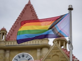 A Pride flag flies in front of Old City Hall in Calgary on Aug. 27, 2021.