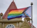 A Pride flag flies in front of Old City Hall in Calgary on Aug.  27, 2021. 