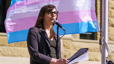 Anna Murphy, Vice-Chair of the city of Calgary Social Wellbeing Advisory Committee, speaks at the Transgender community flag flying at city hall in Calgary on Thursday, March 31, 2022.