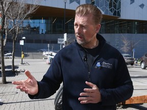 Public Safety and Emergency Services Minister Mike Ellis speaks to the media before a tour of East Village and part of downtown Calgary on Thursday, March 23, 2023.