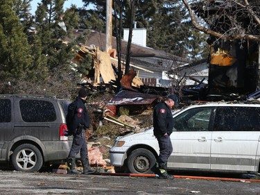 Investigators are shown at the scene of an explosion on Maryvale Way N.E. in Calgary on Monday, March 27, 2023.