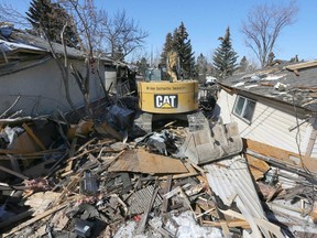 Debris is shown at an explosion scene on Maryvale Way N.E. in Calgary on Tuesday, March 28, 2023. Investigators are combing through the rubble to determine a cause of an explosion on Monday morning.