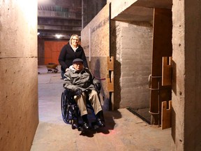 Jade Getz, VP of Development and Design, joins former carpenter Eric Haffenden as he tours the Barron Building, which is undergoing renovations on Wednesday, March 29 in downtown Calgary.  On the right is a former elevator shaft being renovated and brought back to life with modern standards.