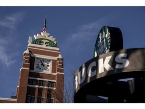 A logo on the clock tower of the Starbucks Corp. headquarters in Seattle, Washington, US, on Wednesday, Jan. 11, 2023. Starbucks might boost fiscal 2023 US same-store sales by mid- to high-single digits via a transformation effort that added locations with drive-thrus, representing 47% of total US revenue, and with a strong digital business aided by enhanced tech.