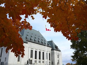 The Supreme Court of Canada is pictured under autumn colored leaves in Ottawa, on Thursday, October 20, 2022.