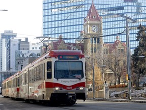 A CTrain passes city hall in downtown Calgary on Friday, January 20, 2023.