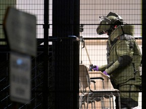 A member of a bomb disposal team works inside the building after several people have reportedly been killed or seriously injured in a shooting at a Jehovah's Witness hall in Hamburg, Germany, March 10, 2023.