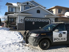 Calgary police hold the scene on Eldorado Place NE in Calgary on Thursday, March 2, 2023. On Wednesday, March 1, 2023, investigators executed a search warrant at a home and arrested Christopher Ward Dunlop in connection with the death of Judy Maerz.