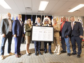 FILE PHOTO: A group photo is taken after a deal is announced between Enbridge and 23 First Nations and Metis communities. From left to right: Colin Gruending, Executive VP and President Liquids Pipelines, Al Monaco, President and CEO, Enbridge, Chana Martineau, Alberta Indigenous Opportunities Corporation (AIOC) CEO, former premier Jason Kenney, Greg Desjarlais, Chief of Frog Lake First Nation, Justin Bourque, President, Athabasca Indigenous Investments, Stan Delorme, Chairperson Buffalo Lake Metis Settlement and Rick Wilson, Minister of Indigenous Relations. Taken on Wednesday, Sept. 28, 2022 in Edmonton.