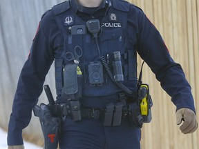 Calgary police with body cameras check out a possible shooting in N.W. Calgary on Tuesday, March 14, 2023.