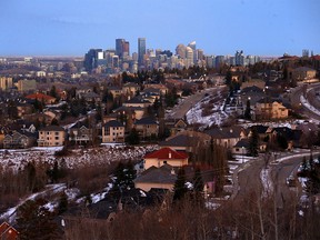 Calgary homes are seen before the city's skyline on Thursday, November 24, 2022. The City of Calgary has finalized its tax rates for 2023.