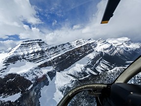 A birds-eye view of the snow-capped peaks of the Canadian Rockies near the Columbia Icefield outside Jasper Alberta, from a Rockies Heli Tours copter.