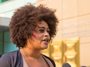 Black Lives Matter organizer Taylor McNallie speaks with media outside the Calgary Courts Centre on July 26, 2021.