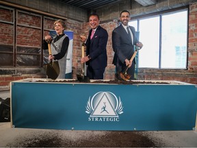 Calgary Mayor Jyoti Gondek, Strategic Group CEO Riaz Mamdani and Skyview MP George Chahal take part in a ceremonial sod at the official launch of the Barron Building redevelopment in downtown Calgary on Wednesday , March 15, 2023. Strategic Group is redeveloping the city center. historic office tower in a residential building.