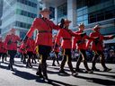 RCMP members march during the Calgary Stampede parade in Calgary, Friday, July 6, 2018.