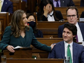 Canada's Prime Minister Justin Trudeau looks at Canada's Deputy Prime Minister and Minister of Finance Chrystia Freeland as she presents the federal government budget for fiscal year 2023-24 in the House of Commons on Parliament Hill in Ottawa, Ontario, Canada March 28, 2023.