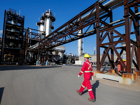 A Shell employee walks past the company's new Quest Carbon Capture and Storage facility in Fort Saskatchewan, Alta.