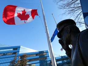 Flags at City Hall where at half mast to honour two Edmonton police officers killed in the line of duty in Calgary on Thursday, March 16, 2023.