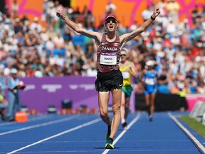 Canada's Evan Dunfee wins gold in the men's 10,000m Race Walk final at the 2022 Birmingham Commonwealth Games. An announcement is expected soon about the potential for a joint Calgary-Edmonton bid for the 2030 Games.