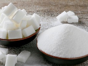 Granulated white sugar and sugar cubes are seen in this picture illustration taken Dec. 16, 2018.