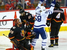 Calgary Flames goaltender Jacob Markstrom is scored on by Toronto Maple Leafs forward Mitch Marner at the Scotiabank Saddledome in Calgary on Thursday, March 2, 2023.