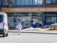 Forensics on the scene at Charles P. Allen High School in Halifax, Monday, March 20, 2023. The Halifax school where two staff were stabbed on Monday is reopening today with counselling being provided.THE CANADIAN PRESS/Riley Smith