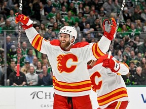 Calgary Flames centre Jonathan Huberdeau celebrates a goal scored by left wing Nick Ritchie (not pictured) against the Dallas Stars during the first period at the American Airlines Center.