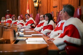Canada’s Supreme Court Justices, from left: Sheilah Martin, Russell Brown, Michael Rowe, Nicholas Kasirer, Andromache Karakatsanis, Rosalie Silberman Abella, Michael Moldaver and Suzanne Cote along with Canada’s Supreme Court Chief Justice Richard Wagner.