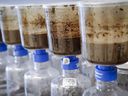 Tailings samples are tested during a tour of Imperial Oil's oil sands research center in Calgary, Tuesday, Aug. 28, 2018. A northern Alberta band chief is angry that he was not notified for nine months after two separate releases of an Imperial oil sand tailings dam does not.