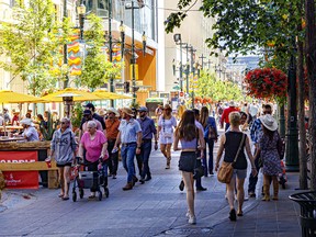 Crowds flock to Stephen Avenue during Stampede week in Calgary on July 15, 2022.