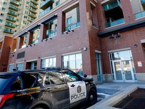 The Calgary Police Service Homicide Unit investigates a suspicious death in a downtown highrise in Calgary on Tuesday, March 28, 2023.