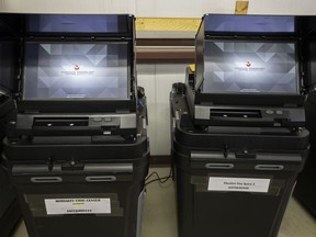 FILE - Dominion Voting ballot-counting machines are shown at a Torrance County warehouse during election equipment testing with local candidates and partisan officers in Estancia, N.M., Sept. 29, 2022. Dominion Voting Systems is suing Fox for $1.6 billion, claiming the news outlet repeatedly aired allegations that the company engaged in fraud that doomed President Donald Trump's re-election campaign while knowing they were untrue. Fox contends that it was reporting newsworthy charges made by supporters of the president and is supported legally by libel standards. The case is scheduled for trial next month.