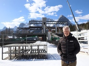 Norbert Meier stands in front of the construction of a new biathlon centre, part of the Canmore Nordic Centre's $17 million in upgrades to ensure its World Cup host status on Friday March 31, 2023. The upgrades also include the day lodge building and the expansion of the Frozen Thunder snow farm. All upgrades are to be completed by the end of 2023 and will continue to build on the legacy of this 1988 Winter Olympics facility.