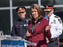 Premier Danielle Smith speaks during a press conference on Tuesday announcing 100 new police officers for Calgary and Edmonton. 