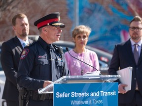 Calgary Police Chief Mark Neufeld speaks during a press conference announcing measures to tackle the rising violent crimes in Calgary and Edmonton outside the Sunalta CTrain station in Calgary on Tuesday.