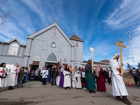 Way of the Cross procession walk out of Our Lady of Fatima Parish in southeast Calgary on Friday, April 7.