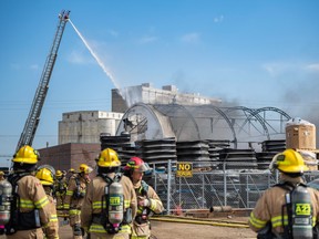 Calgary Fire Department extinguishes a fire at an auto recycling plant in southeast Calgary on Tuesday, April 11.